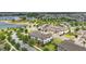 A high-angle view of a residential area features homes, landscaped spaces, and tranquil ponds at 16163 Pebble Bluff Loop, Winter Garden, FL 34787