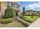 Inviting two-story home featuring a well-kept lawn and a cozy front porch at 16163 Pebble Bluff Loop, Winter Garden, FL 34787