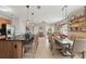 Bright kitchen with a large island, stainless steel appliances, and an open view to the dining and living areas at 16163 Pebble Bluff Loop, Winter Garden, FL 34787