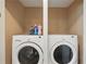 Convenient laundry room with a full-size washer and dryer at 16163 Pebble Bluff Loop, Winter Garden, FL 34787