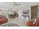 Inviting living room with a view into the kitchen, and stairs leading to upper level at 16163 Pebble Bluff Loop, Winter Garden, FL 34787
