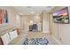 Upstairs living room with a TV, a gray sofa and carpeted floors at 16163 Pebble Bluff Loop, Winter Garden, FL 34787