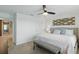 Inviting main bedroom features a ceiling fan and comfortable furnishings at 16163 Pebble Bluff Loop, Winter Garden, FL 34787