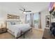 Serene main bedroom featuring a ceiling fan, large windows, and neutral decor at 16163 Pebble Bluff Loop, Winter Garden, FL 34787