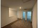 Hallway features neutral carpet, white walls, and doors leading to other rooms in the home at 16468 Happy Eagle Dr, Clermont, FL 34714
