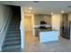 Modern kitchen with stainless steel appliances, granite countertops, and a spacious island at 16468 Happy Eagle Dr, Clermont, FL 34714