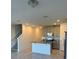Modern kitchen features granite countertops, stainless appliances, and open layout at 16468 Happy Eagle Dr, Clermont, FL 34714