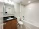 Bright bathroom with a shower-tub combo, and a vanity with granite counters at 16518 Brook Springs Aly, Winter Garden, FL 34787