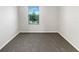 Minimalist bedroom featuring a gray carpet, window with blinds, and natural light at 16518 Brook Springs Aly, Winter Garden, FL 34787