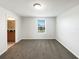 Bedroom with neutral carpet, a window for natural light, and an ensuite bathroom at 16518 Brook Springs Aly, Winter Garden, FL 34787