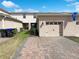 Attractive home exterior with a brick driveway and two-car garage at 16518 Brook Springs Aly, Winter Garden, FL 34787