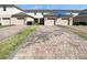 Townhome exterior featuring brick driveways and attached garages at 16518 Brook Springs Aly, Winter Garden, FL 34787
