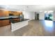 Open kitchen layout with stainless steel appliances, granite countertops, and tile flooring at 16518 Brook Springs Aly, Winter Garden, FL 34787