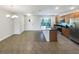 Open-concept kitchen with stainless steel appliances and a large island at 16518 Brook Springs Aly, Winter Garden, FL 34787