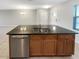 Kitchen island featuring dark countertops and stainless steel appliances at 16518 Brook Springs Aly, Winter Garden, FL 34787