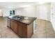 Spacious kitchen island with granite countertop and stainless steel sink at 16518 Brook Springs Aly, Winter Garden, FL 34787