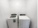 White laundry room featuring a washer and dryer for convenient in-home laundry at 16518 Brook Springs Aly, Winter Garden, FL 34787