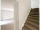 Carpeted staircase leading to the upper level of the home at 16518 Brook Springs Aly, Winter Garden, FL 34787