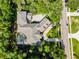 An aerial view showcases this estate, including a circular drive and screened pool at 1724 Cottonwood Creek Pl, Lake Mary, FL 32746