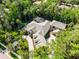 Spacious landscaped home with a screened in pool and a circular driveway at 1724 Cottonwood Creek Pl, Lake Mary, FL 32746