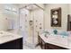 Elegant bathroom with a glass-enclosed shower, soaking tub, and modern fixtures at 1724 Cottonwood Creek Pl, Lake Mary, FL 32746