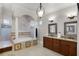 Luxurious bathroom with a soaking tub, tiled shower, and dual vanity sinks for ultimate comfort at 1724 Cottonwood Creek Pl, Lake Mary, FL 32746