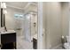 Bright bathroom with glass shower, double sinks, and neutral tones at 1724 Cottonwood Creek Pl, Lake Mary, FL 32746