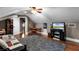 Bonus room featuring a low ceiling, ceiling fan, TV and seating at 1724 Cottonwood Creek Pl, Lake Mary, FL 32746
