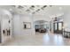 Spacious foyer and dining room featuring a coffered ceiling and large arched doorways at 1724 Cottonwood Creek Pl, Lake Mary, FL 32746