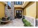 Inviting home entrance with stone accents, double doors, and a charming water fountain at 1724 Cottonwood Creek Pl, Lake Mary, FL 32746