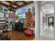 Game room boasts hardwood floors, sports-themed decor, and a hallway leading to another part of the home at 1724 Cottonwood Creek Pl, Lake Mary, FL 32746