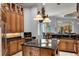 Well-appointed kitchen with custom cabinets, granite countertops, and a center island perfect for entertaining at 1724 Cottonwood Creek Pl, Lake Mary, FL 32746