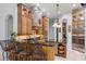 This kitchen boasts a stone range hood, granite countertops, and stainless steel appliances at 1724 Cottonwood Creek Pl, Lake Mary, FL 32746