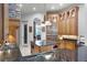 Gourmet kitchen features custom cabinets, stainless steel appliances, a large island with granite countertops at 1724 Cottonwood Creek Pl, Lake Mary, FL 32746
