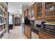 Convenient kitchenette featuring granite countertops, modern appliances, and ample cabinet space at 1724 Cottonwood Creek Pl, Lake Mary, FL 32746