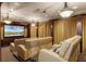 Luxurious home theater with comfortable seating, projector screen, and ambient lighting at 1724 Cottonwood Creek Pl, Lake Mary, FL 32746