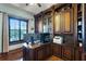 Well-appointed office with custom wood cabinetry and a built-in desk at 1724 Cottonwood Creek Pl, Lake Mary, FL 32746