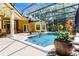 Screened in pool area featuring a pool, spa, patio and a water feature at 1724 Cottonwood Creek Pl, Lake Mary, FL 32746