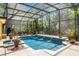 Enjoy this private screened-in pool with a hot tub, water features and peaceful views at 1724 Cottonwood Creek Pl, Lake Mary, FL 32746
