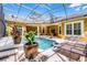 Stunning screened-in pool with sun loungers and lush landscaping at 1724 Cottonwood Creek Pl, Lake Mary, FL 32746