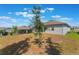 Expansive backyard with lush green lawn, view of lake, perfect for outdoor activities and relaxation at 1757 Brush Cherry Pl, Ocoee, FL 34761