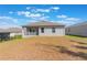 View of the backyard showing the back of the home and patio at 1757 Brush Cherry Pl, Ocoee, FL 34761