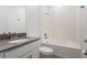 Bathroom with a shower-tub combo, modern vanity, and neutral decor at 1757 Brush Cherry Pl, Ocoee, FL 34761