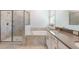 Bathroom boasts a separate shower and soaking tub with neutral tiling and dual sinks at 1757 Brush Cherry Pl, Ocoee, FL 34761