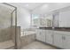 Modern bathroom featuring a separate shower, soaking tub, and double vanity sinks at 1757 Brush Cherry Pl, Ocoee, FL 34761
