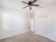 Bedroom features carpet, a ceiling fan, and a large closet with neutral walls at 1757 Brush Cherry Pl, Ocoee, FL 34761