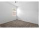 Bright bedroom with plush carpet, white walls, and natural light from the window at 1757 Brush Cherry Pl, Ocoee, FL 34761