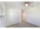 Well-lit bedroom with closet and ceiling fan features neutral walls and plush carpeting at 1757 Brush Cherry Pl, Ocoee, FL 34761