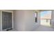 Close up of the front door and the covered porch with white railings and stone supports at 1757 Brush Cherry Pl, Ocoee, FL 34761