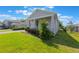Charming single-story home with manicured lawn and inviting front porch at 1757 Brush Cherry Pl, Ocoee, FL 34761